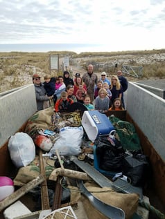 It takes a whole village to clean the beach! 